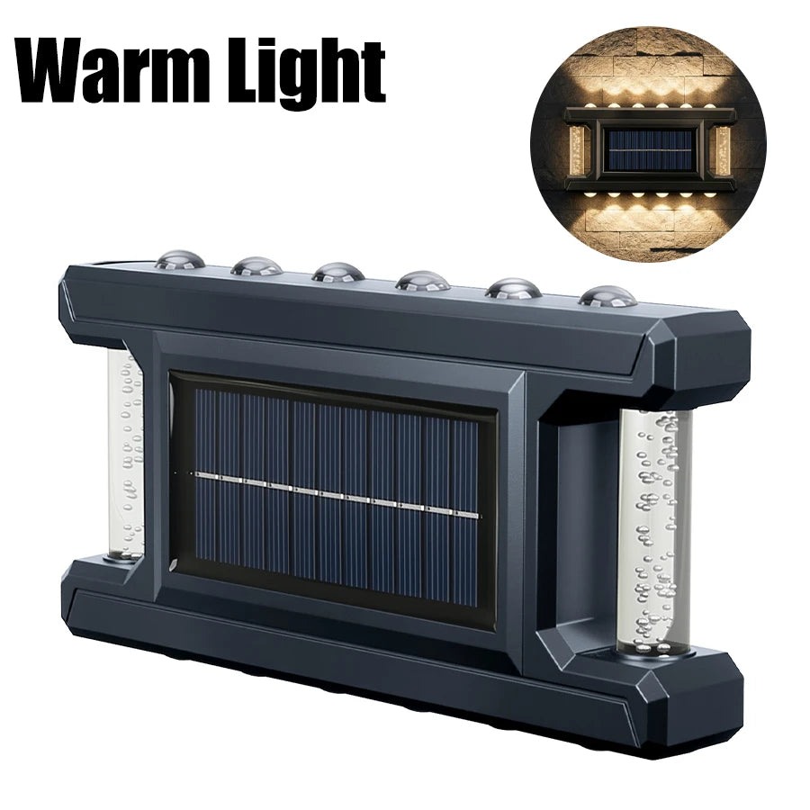 A dark gray solar powered outdoor wall light with a rectangular panel and an illuminated vertical element.