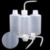 Clear plastic tattoo squeeze bottles with precision tips and a measuring device