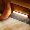 A rechargeable motion sensor LED night light mounted on a wooden surface, showing a 120-degree beam and 3-meter range.
