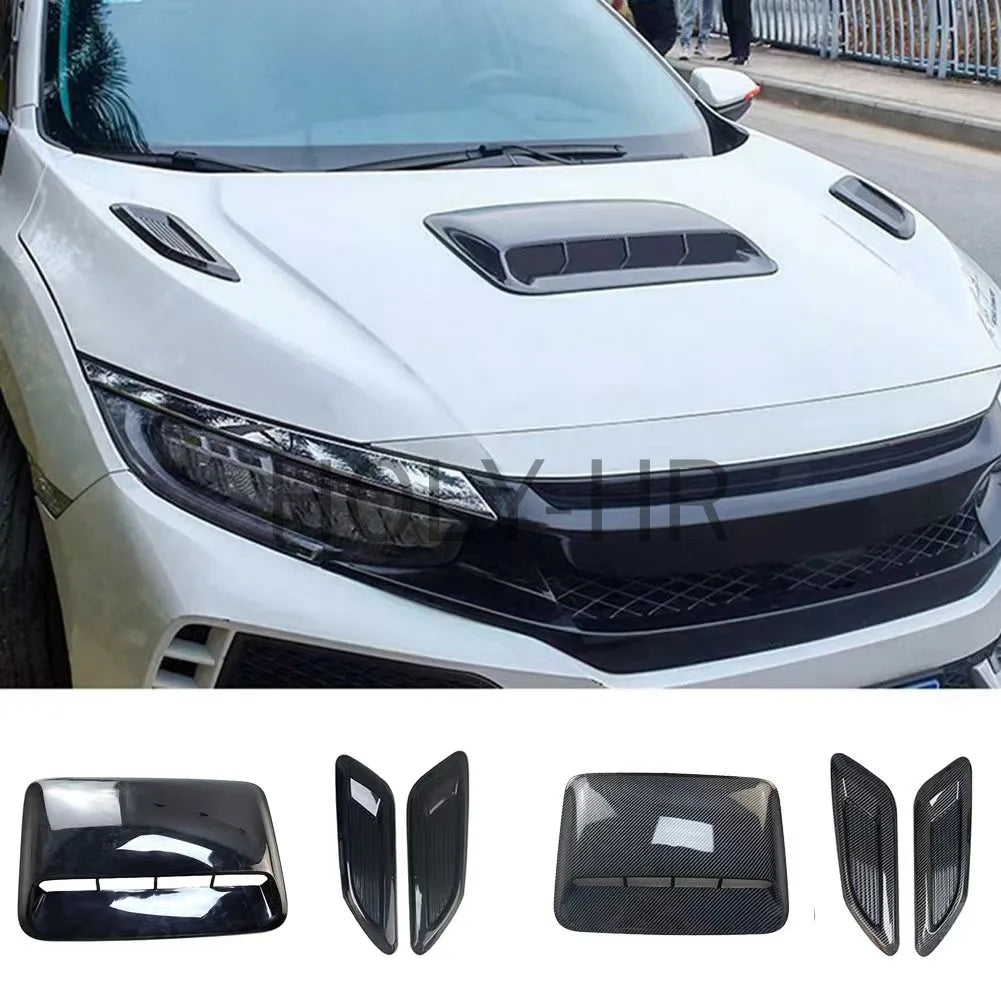 Black decorative hood scoop covers and air intake vents for a vehicle.