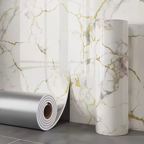Roll of peel and stick wallpaper featuring a white marble effect with gold veining