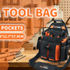 An orange and black tool bag with 16 pockets is displayed on a wooden workbench surrounded by various tools.