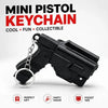 Black mini pistol keychain accessory with a silver chain, shown against a white background.