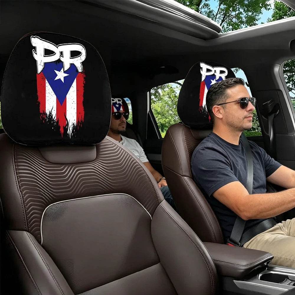 Two black car headrest covers featuring a patriotic design are visible in the interior of a vehicle.