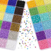 A collection of multicolor acrylic rice beads in various colors and sizes stored in a 24-grid box.