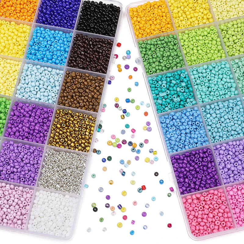 A collection of multicolor acrylic rice beads in various colors and sizes stored in a 24-grid box.