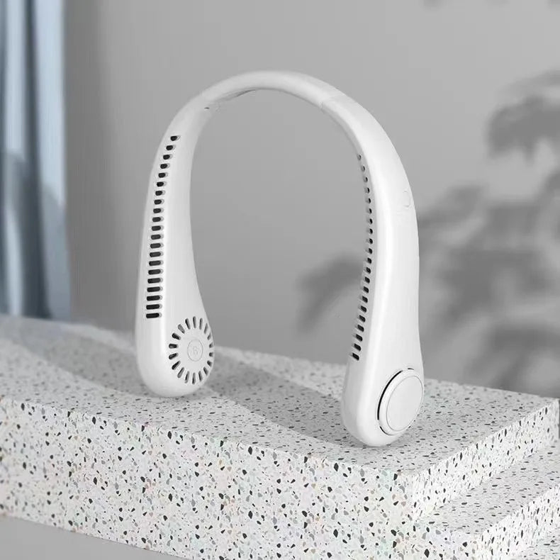 A white hands-free bladeless neck fan with a digital display is shown resting on a textured surface.
