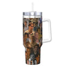 A clear insulated stainless steel tumbler with a silver lid featuring a collage of male faces.