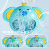 A light blue elephant water spray bath toy for kids with clear bubbles and a yellow crown.