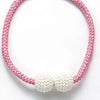 Pink braided cord bracelet with white pearl beads
