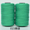 Spool of 3-ply green polyester knitting yarn for crochet and hand crafts