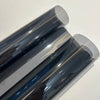 Close-up view of a roll of ceramic car window tint film showing its smooth, reflective surface.