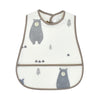 A white baby feeding bib with a gray bear design and a catch pocket, featuring a brown trim.