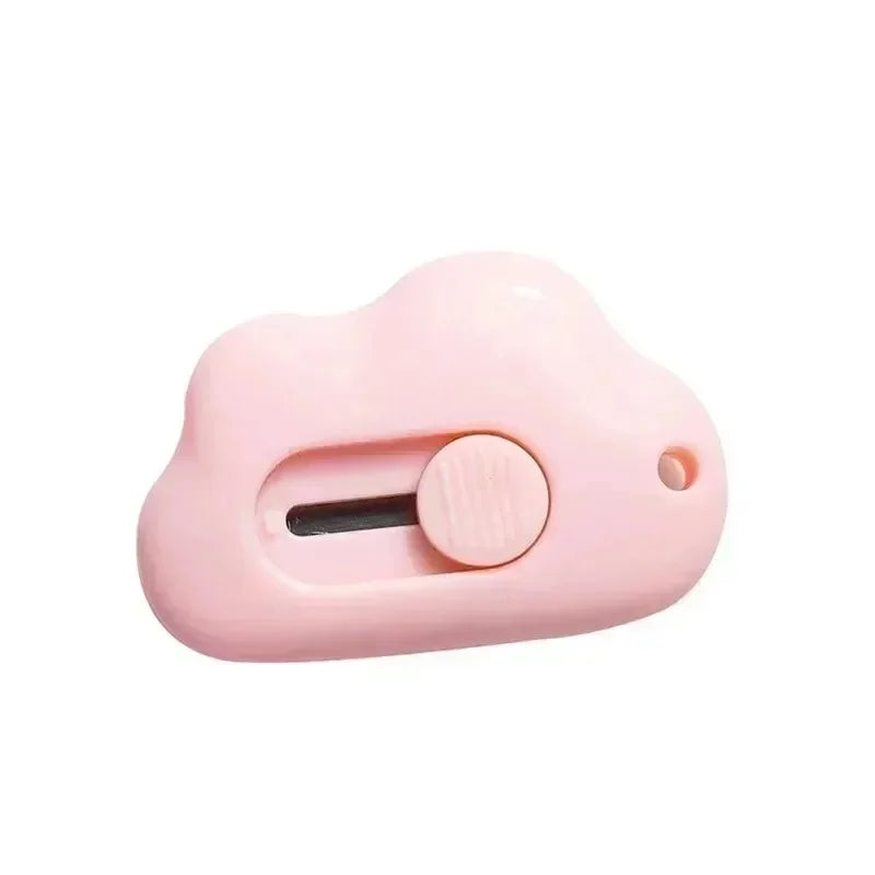 A pink compact rabbit mini cutter with a retractable blade.
