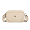 A beige lightweight water-resistant nylon crossbody bag with a flap closure and adjustable strap.