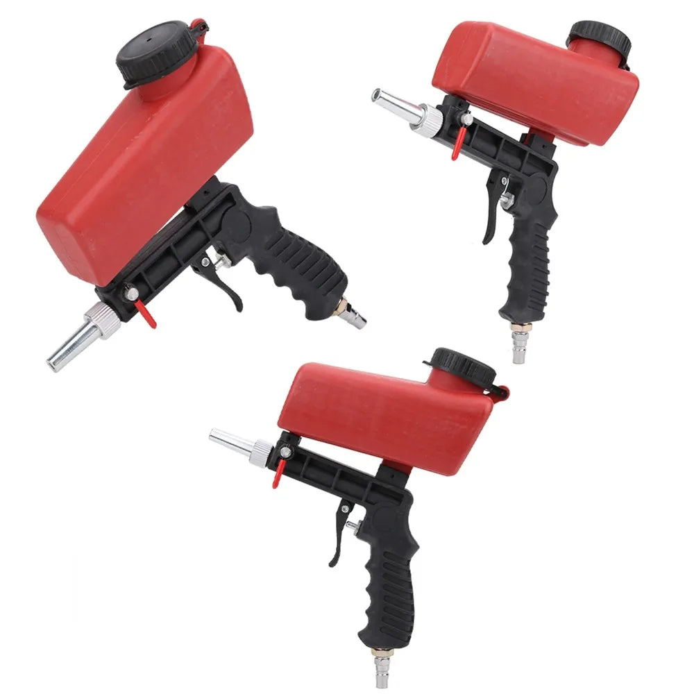 A red and black handheld pneumatic sandblasting gun with a hopper and nozzle assembly.