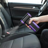 A hand is using a purple and black high-speed brushless DC air blower to blow air onto a car interior surface.