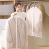 A white transparent zippered garment bag is hanging on a wooden rack, showing its clear material and design.