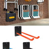 A heavy-duty wall-mounted organizer rack for garden tools, featuring various hooks and holders in black, white, and orange.