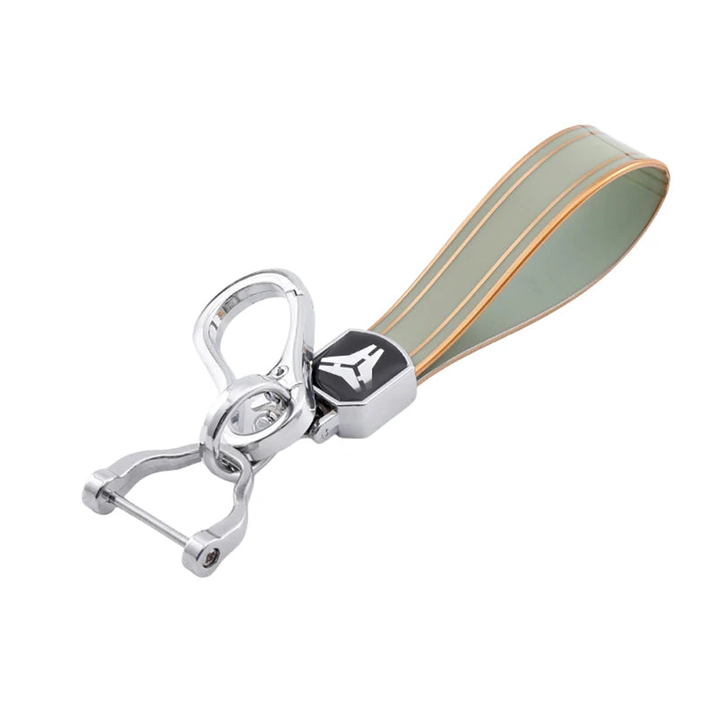 Silver keychain with a durable TPU car key fob cover featuring a translucent green and gold gradient.