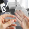 A hand is holding a clear magnetic card protector sleeve, demonstrating its transparent and protective design.