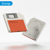 Orange M.2 SSD enclosure device shown in a white casing with an orange connector.