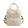 A beige insulated leakproof reusable lunch bag with a padded top and zippered compartments.