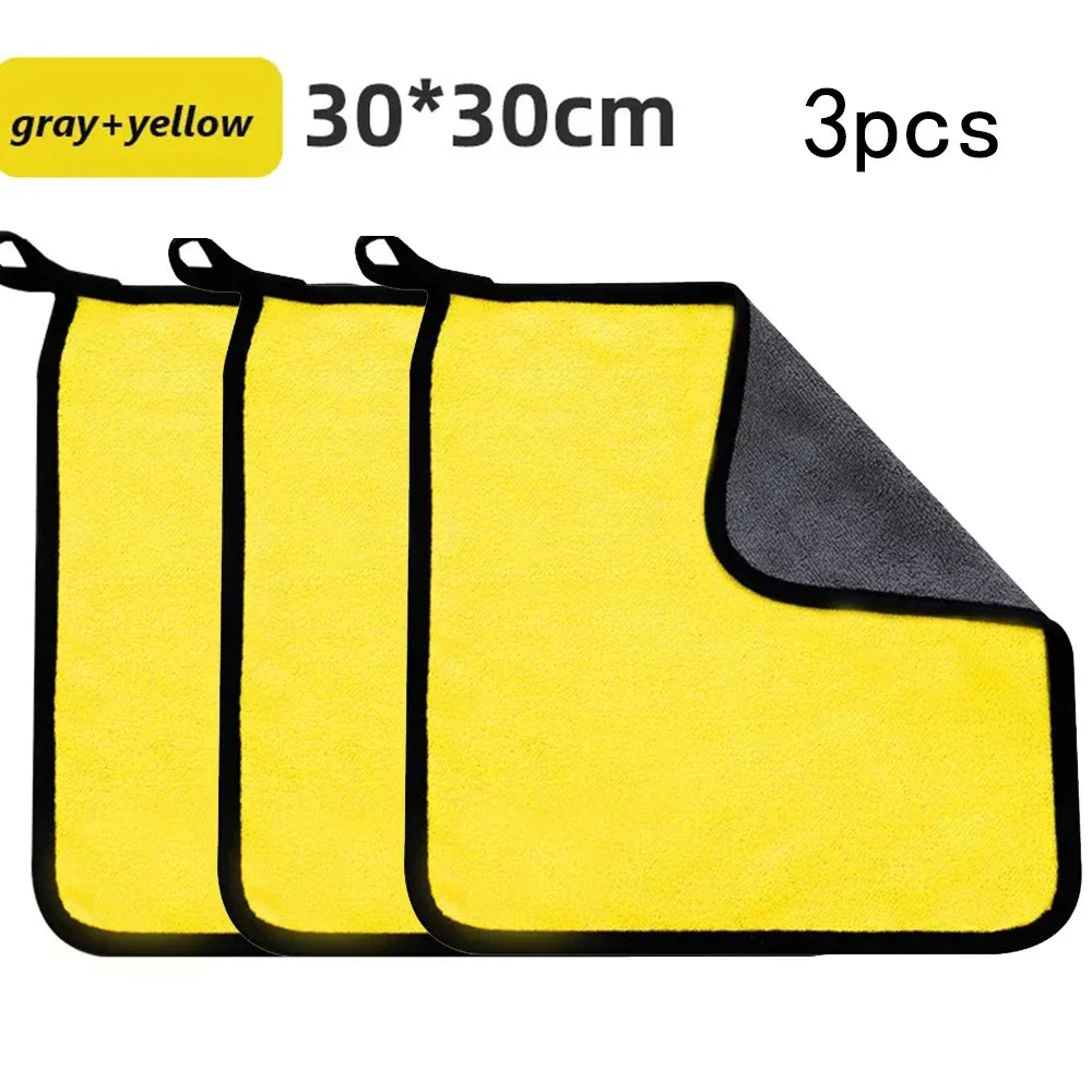Three yellow and gray microfiber car cleaning towels are displayed, showing their rectangular shape.