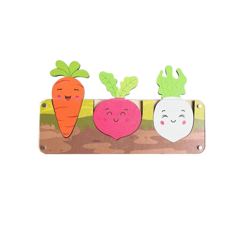 A wooden busy board featuring cutouts of carrots and a watermelon, designed for toddlers.