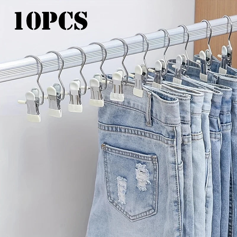 Ten stainless steel clothespins with hooks used to organize clothing on a hanger.