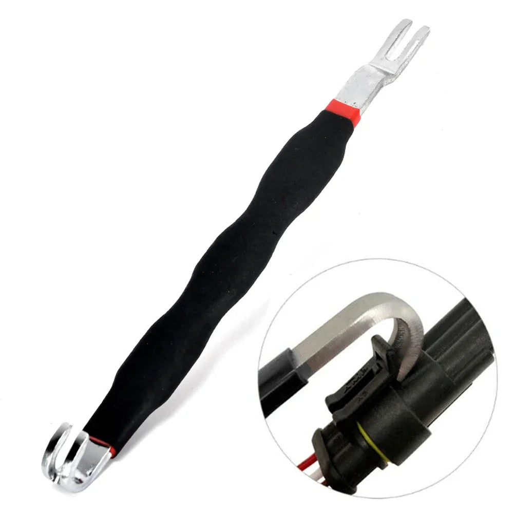 A black automotive electrical terminal connector removal tool with silver tips and a black insulated handle.