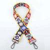 A colorful floral jacquard strap for an elegant crossbody bag, featuring yellow and purple patterns.