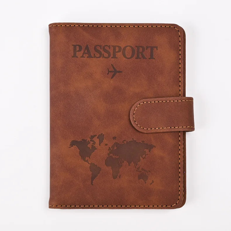 A brown leather passport holder embossed with the word PASSPORT and a world map design.