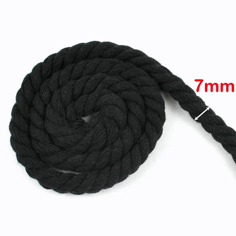 Black natural twisted cotton cord with a 7mm thickness shown in a coiled form.