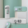 A set of child safety cabinet locks in mint green and white are displayed on a light green background.