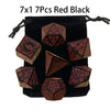 A set of seven polyhedral dice in red and black colors packaged in a black pouch.