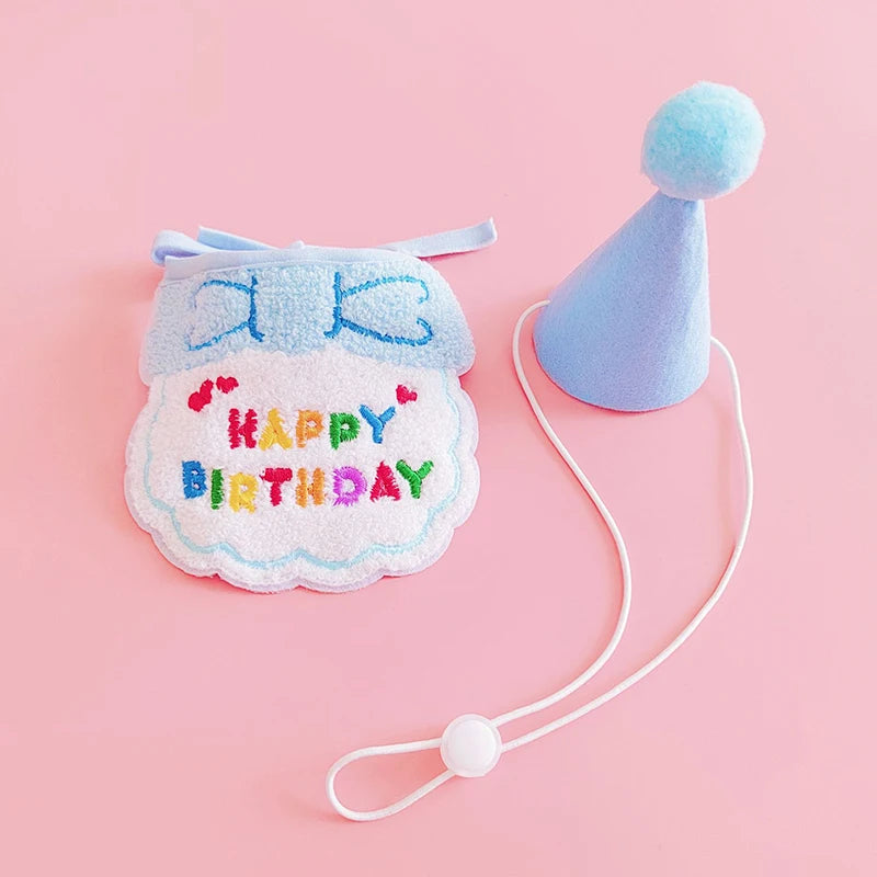 A light blue pet birthday party hat and bib set for cats and small dogs with a string.