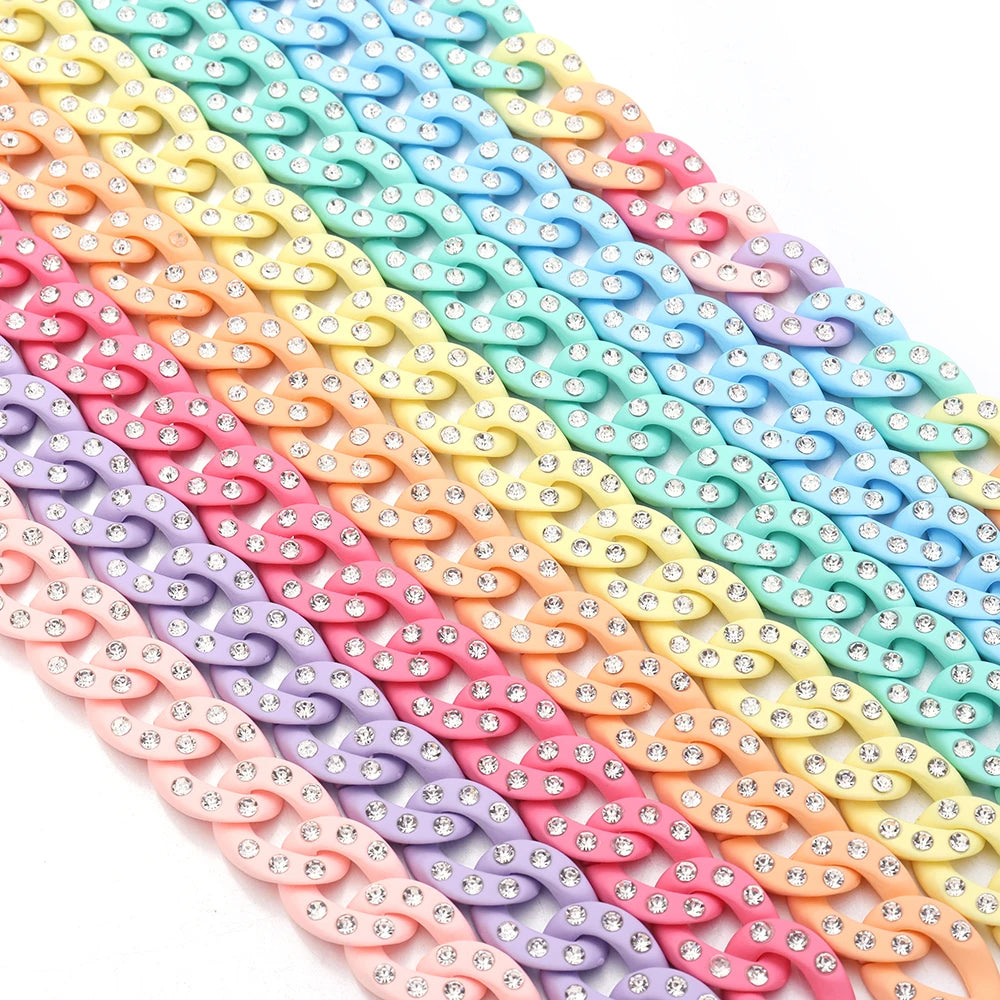 A colorful set of 20 acrylic jewelry connector clasps with crystal accents arranged in a diagonal line.