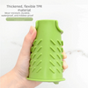 A hand holds a bright green silicone sink faucet mat with a textured, ribbed design.