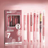 A pack of seven pink and black gel pens displayed in a cardboard box with a minimalist design.