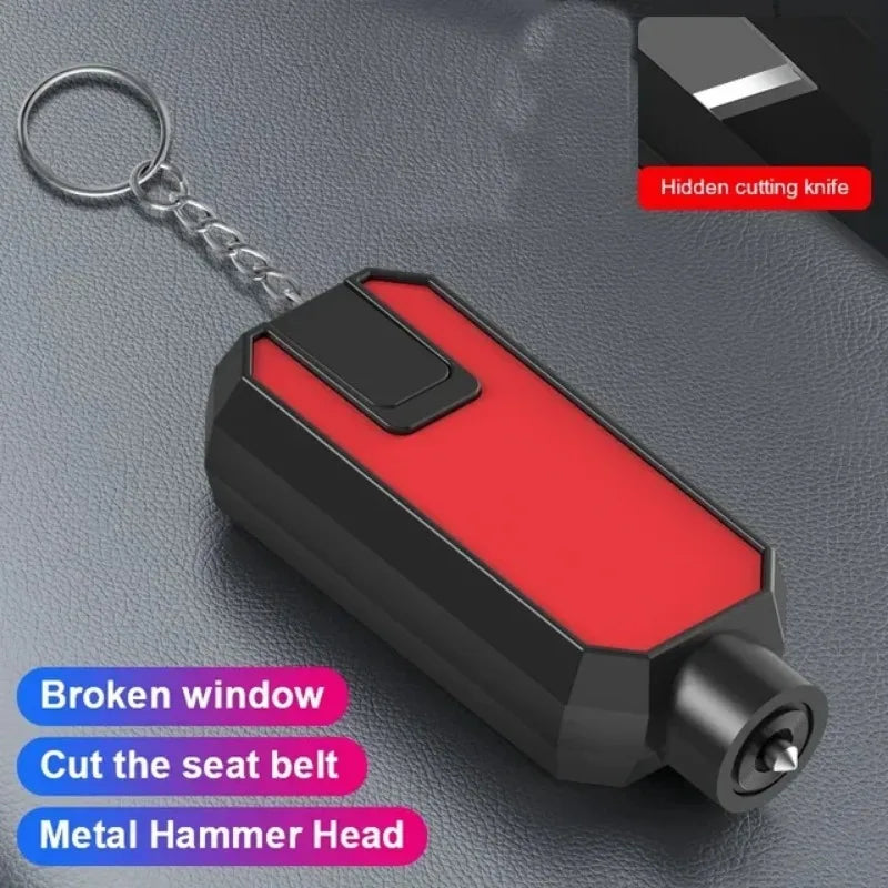 A black and red emergency car safety hammer with a metal head is shown on a dark surface.