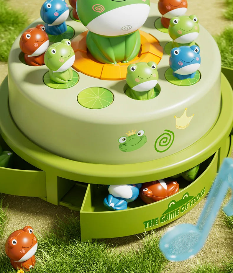 A green cake decorated with plastic frog figures in various colors, set on a grassy surface.