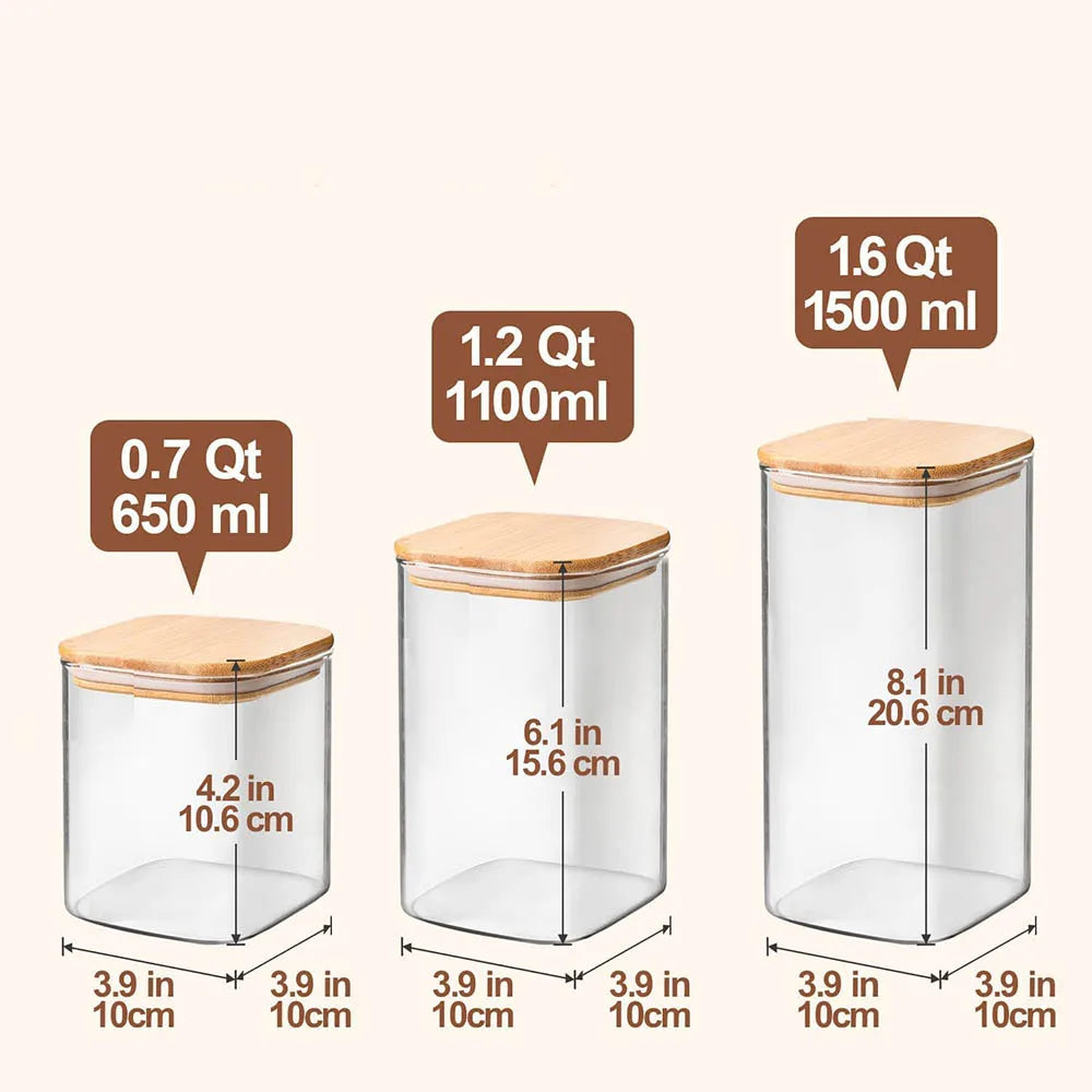 A set of clear glass storage canisters with bamboo lids, showing various sizes and capacities.