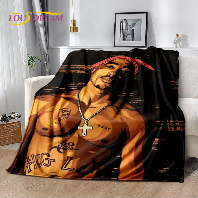 A throw blanket featuring a portrait of Eminem and 2Pac in an orange and black color scheme.