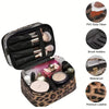 A leopard print transparent double-layer makeup bag with brush holders and waterproof features.