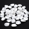 A pile of 100 white acrylic pearl spacer beads for jewelry making
