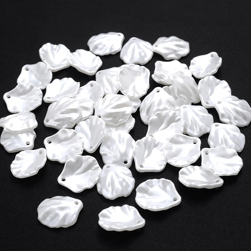 A pile of 100 white acrylic pearl spacer beads for jewelry making
