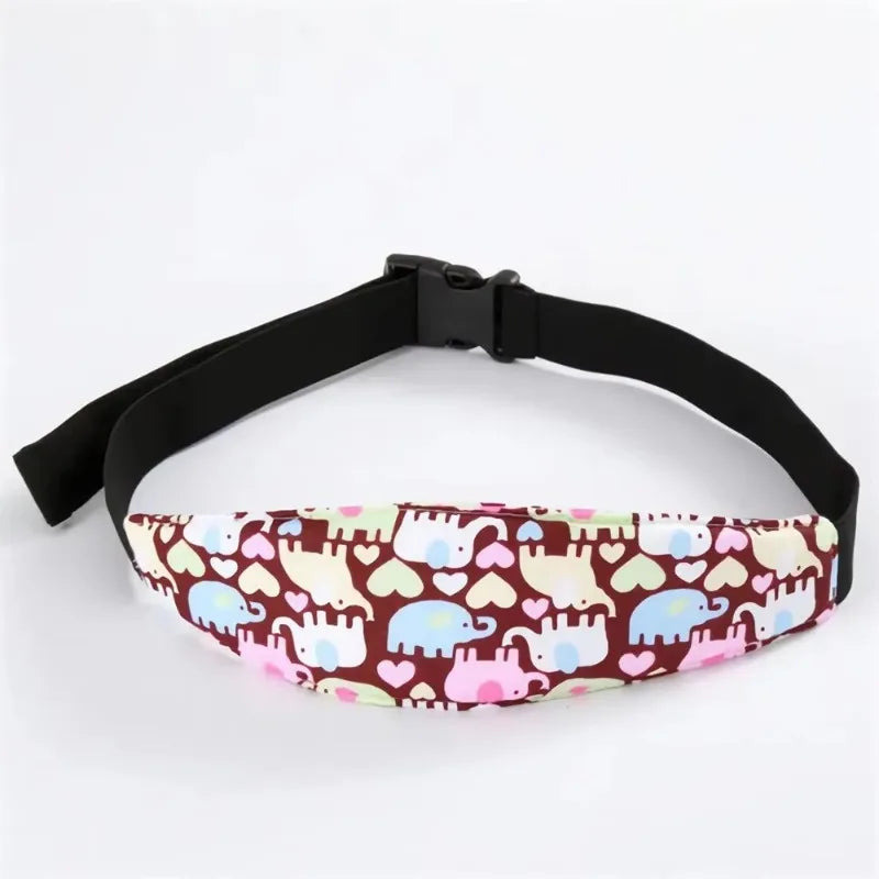 Black adjustable baby car seat sleeping headrest with a patterned fabric and a black belt strap.