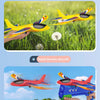 A hand-thrown yellow foam airplane flying over green grass, next to a hand-held red and blue aircraft gun toy.
