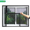 A hand is opening a window featuring a black frame and a mesh mosquito net screen on a glass window.